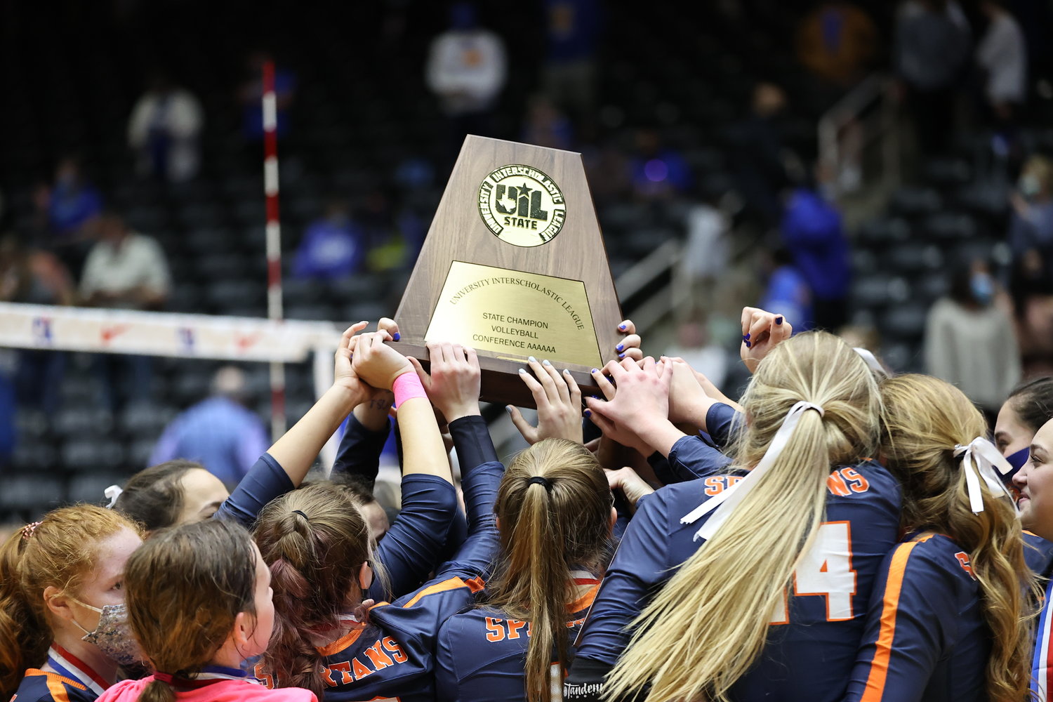 Seven Lakes players celebrate after winning the Class 6A state championship match over Klein on Dec. 12 at the Culwell Center in Garland.
